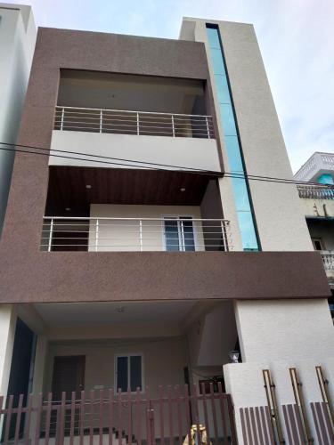 a building with a fence in front of it at rest n' refresh in Visakhapatnam
