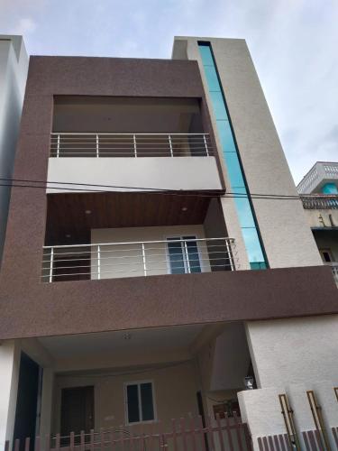 a building with balconies on the side of it at rest n' refresh in Visakhapatnam