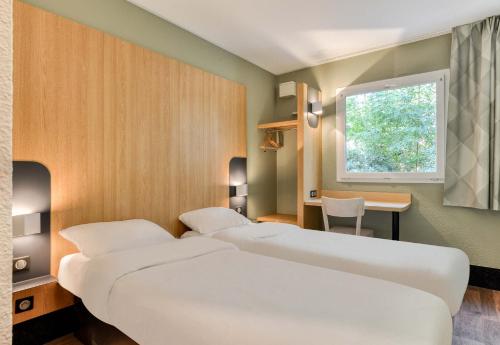 Postel nebo postele na pokoji v ubytování B&B HOTEL Béziers