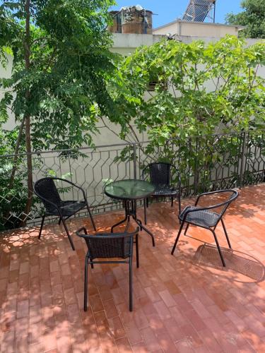 a group of chairs and a table on a patio at Mariyka Apartaments 2 in Sutomore