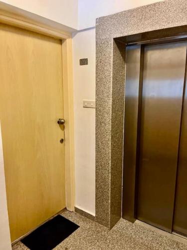 a elevator door in a room with a hallway at Eliza Suite at Pernera Beach in Protaras