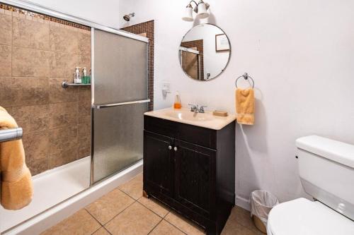 a bathroom with a sink and a shower at Serenity House near Gaslamp, San Diego Zoo & Petco in San Diego