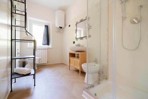 a bathroom with a shower and a toilet and a sink at Villa Chiara Porto Recanati in Porto Recanati