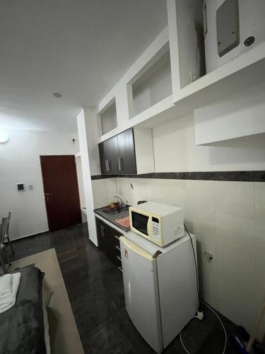Cuisine ou kitchenette dans l'établissement DERC Temporarios
