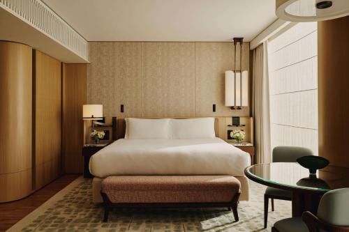 a hotel room with a bed and a table at The Emory in London