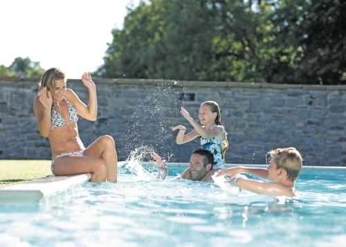 a group of people playing in a swimming pool at Ribblesdale Lodges in Gisburn