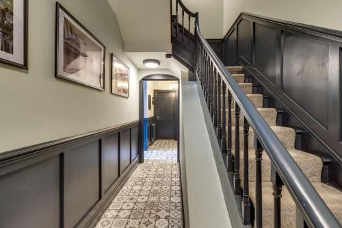 a hallway with stairs in a house at The Boat House Luxury Apartments Scarborough in Scarborough