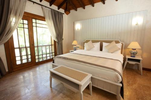 Ένα ή περισσότερα κρεβάτια σε δωμάτιο στο Casa Giallo Managed By Dedeman