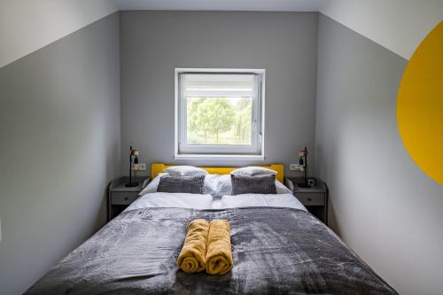 Katil atau katil-katil dalam bilik di Balatonic Lemon apartmanház