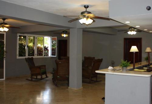 a living room filled with furniture and lights at Hotel Marimba Punta Cana in Punta Cana
