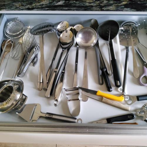 a tray filled with lots of kitchen utensils at Holiday Home IRENE in Lilo