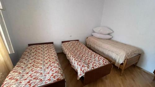 a room with two beds in a room at Green Paradise in Ijevan