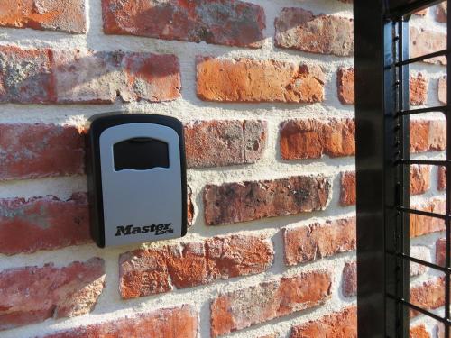 a brick wall with a cell phone on it at Holiday Home IRENE in Lilo