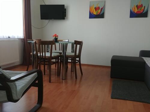 a living room with a table and chairs at Apartman Arena in Štrigova