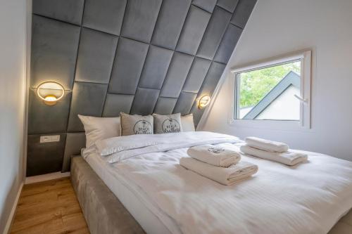 Postel nebo postele na pokoji v ubytování Beach Brothers House Domki nad jeziorem Nyskim