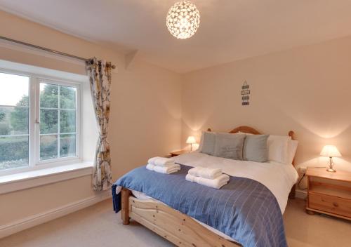 Postel nebo postele na pokoji v ubytování Harmony Cottage