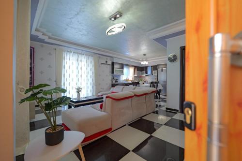 a living room with a couch and a table at Vila Nanaj in Sarandë