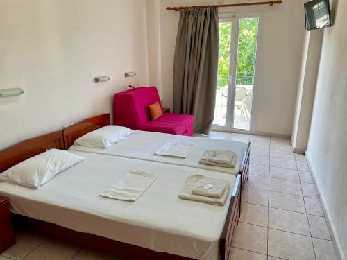 Katil atau katil-katil dalam bilik di Hotel Evagelia