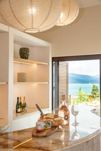 a kitchen with a counter top with a view of the ocean at Tinah Saint-Tropez in Saint-Tropez