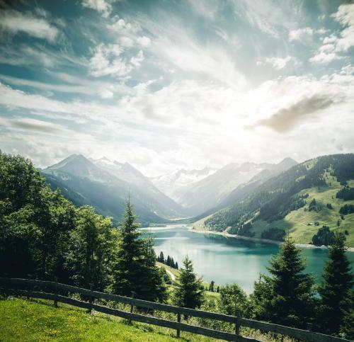 a view of a river with mountains in the background at FRÄULEIN NANNERL - Boutique Apart mit Saunahaus in Gerlos