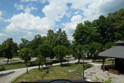 a park with trees and a gazebo at Apartamenty Parkowe nr 5 in Kwidzyn