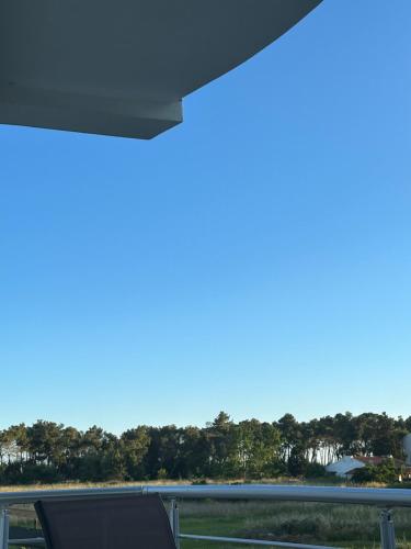 a view of a blue sky from a window at Apartmens Xhenis Lux in Ulcinj