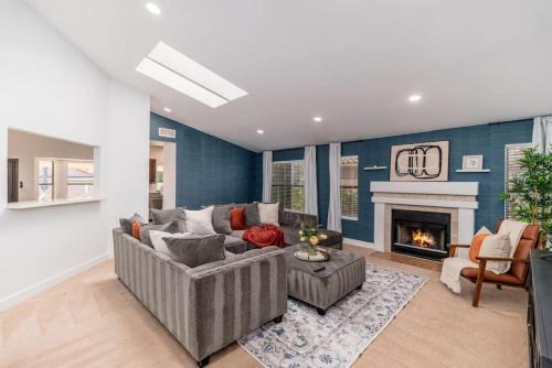 a living room with a couch and a fireplace at Luxury Scottsdale Retreat Heated Pool and Mini Golf in Phoenix