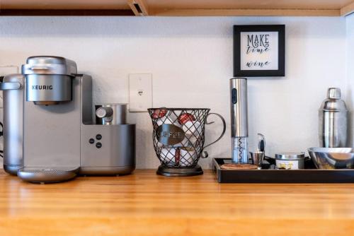 a kitchen with a counter top with a coffee maker at Luxury Scottsdale Retreat Heated Pool and Mini Golf in Phoenix
