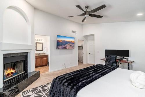a bedroom with a bed and a fireplace at Luxury Scottsdale Retreat Heated Pool and Mini Golf in Phoenix