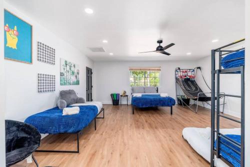 a room with two beds and a slide at Sunshine, Paradise Escape! Private Pool, Sleeps 12 in Phoenix