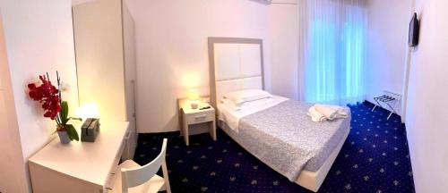 מיטה או מיטות בחדר ב-Terme Villa Pace