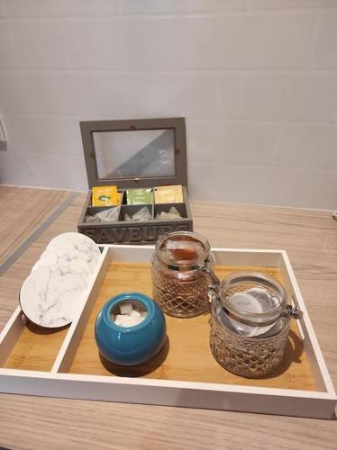 a tray with various items on top of a table at Studio 28 À l'orée de l'eau in Cloyes-sur-le-Loir