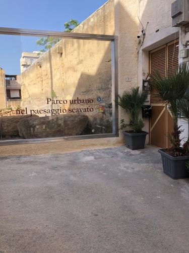 a building with a sign on the side of it at Marsala al centro n 9 in Marsala