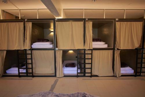 a set of bunk beds in a room at Some Place Else in George Town