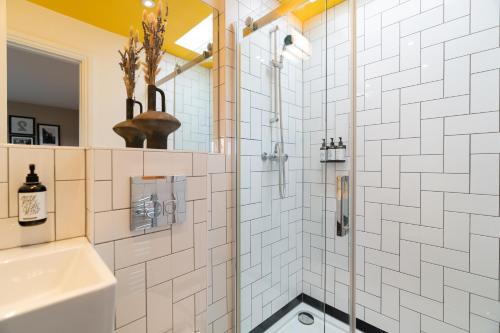 a bathroom with a shower and a sink at room2 London Hammersmith Townhouse in London