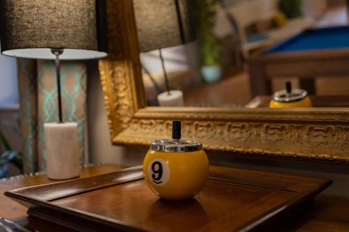 a vase on a table with a candle on it at LA VILLA in Terraube