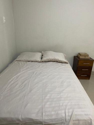 Tempat tidur dalam kamar di Edificio Casuarinas