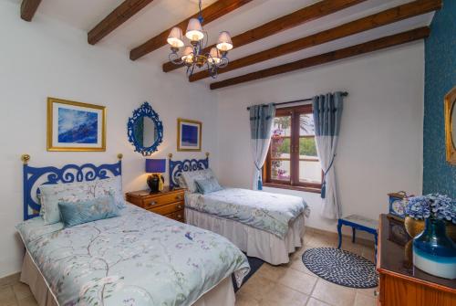 Postel nebo postele na pokoji v ubytování Villa Dune