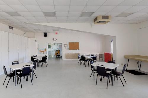a room with tables and chairs in a classroom at Oyster Drive Bungalow in Port Isabel