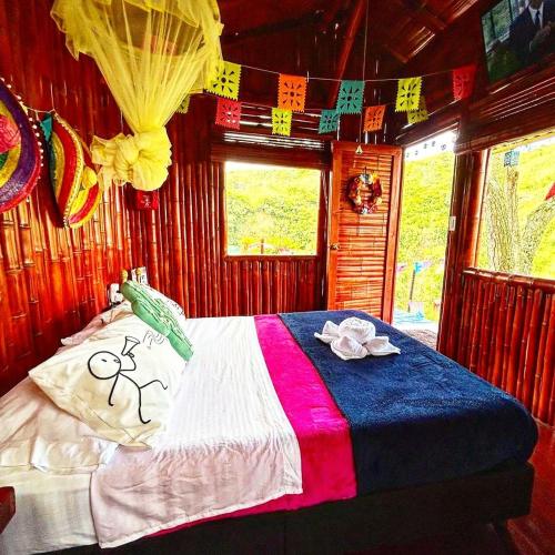 a bedroom with a bed with decorations on it at La Bota del Gigante in Gigante