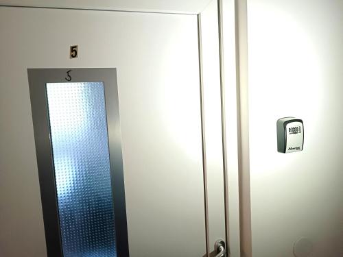 a bathroom with a mirror in a bathroom stall at Family Apartments center of Mürzzuschlag in Mürzzuschlag