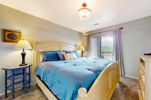 Ένα ή περισσότερα κρεβάτια σε δωμάτιο στο Lake Adventures at Eagle's Nest