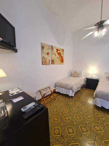 Ένα ή περισσότερα κρεβάτια σε δωμάτιο στο Posada El Capullo