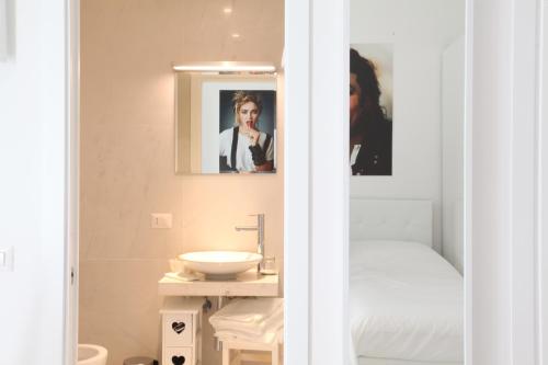 a bathroom with a sink and a mirror at Big Johnny B in Rome
