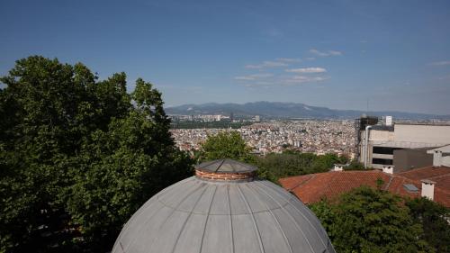 a domed building with a view of a city at Global Termal Hotel in Çekirge