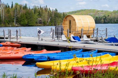 a group of boats parked at a dock on a lake at Estérel Resort in Esterel