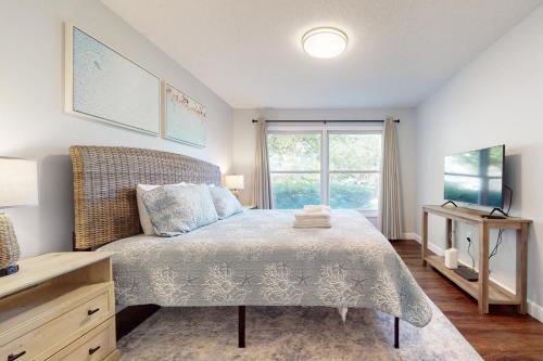 a bedroom with a bed and a window at Sea Colony Canal II in Bethany Beach
