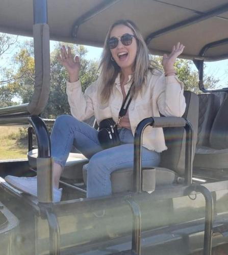 a woman sitting in the back of a vehicle at Livingstone Bush Lodge, Mabalingwe in Bela-Bela