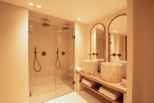 a bathroom with three sinks and a shower at Tinah Saint-Tropez in Saint-Tropez