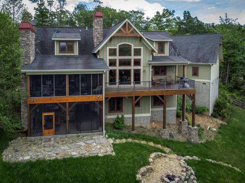 an aerial view of a house with a large deck at Frolly Falls in Black Mountain